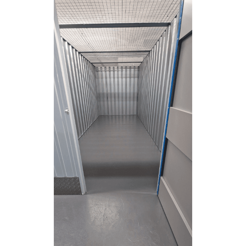 Empty secure 100sqft self storage unit interior view