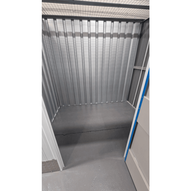 Empty secure 50sqft self storage unit interior